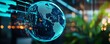 © AucArtStudio - Abstract digital globe with glowing data streams in modern office environment.