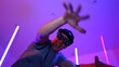 © InfiniteFlow - Low angle camera of caucasian dancer wearing fancy glasses and performing break dancing. Attractive man shown energetic performance and movement while looking at camera with confident. Regalement.