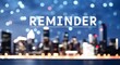 © Erlinda - reminder lettering on business concept urban city skyline blurred lights bokeh background