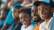 © Serge - family sitting together in the bleachers, enjoying a sports event