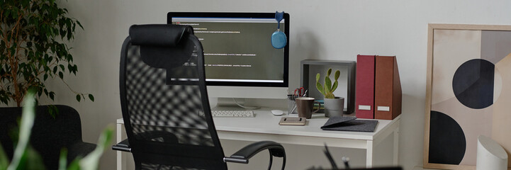 website banner of empty it office with work desk and computer on top