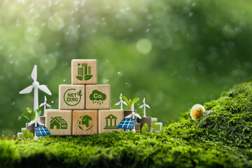 Wall Mural - sustainable green building environmentally friendly buildings Future green business idea Environmental sustainability target. Green building icon on wooden blocks with 3D statue on green background.