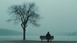 © soysuwan123 - A man sits on a bench by a lake