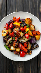 Colorful roasted vegetables on a white plate: carrots, peppers, and onions make a nutritious and delicious dish