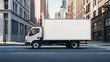 © Curioso.Photography - White delivery truck parked on an urban street with blank advertisement space.