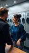 © Pixel Diversity - man and woman conversing, modern interior, casual clothing, lockers in background, friendly interaction, warm lighting, relaxed atmosphere, depth of field