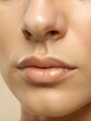 © Vasyl - The lips are perfectly defined, reflecting a healthy glow and hydration. The focus is on the natural beauty of the skin without any makeup, emphasizing skin care importance. Generative AI