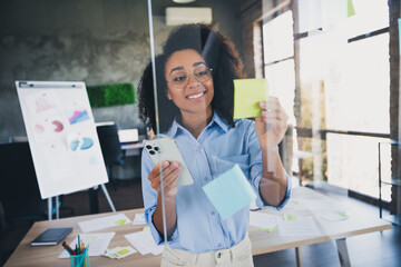 Canvas Print - Photo of adorable positive lady broker wear shirt typing modern device writing stickers indoors workplace workshop