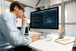 © InfiniteFlow - IT developer working online software development information on pc and laptop screen with typing to create new code program on updated version application project creating overall system. Pecuniary.