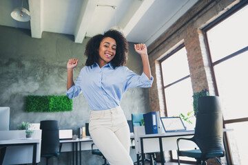 Canvas Print - Photo of lucky positive lady broker wear shirt rising fists smiling indoors workplace workshop