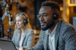 © Pooja - Side view of African American male podcaster in suit and eyeglasses typing on laptop and listening to Caucasian female guest sitting in studio, Generative AI