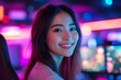 © James - Portrait of smiling Asian woman enjoying video games in cybersports club with neon lights, copy space, Generative AI