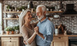 © Kseniya - Middle aged couple dancing at home kitchen