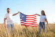 © New Africa - Happy couple with flag of USA outdoors