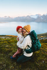 Wall Mural - family time - mother hugging child hiking together, travel lifestyle outdoor active vacations in mou