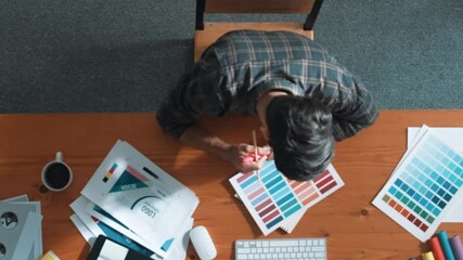 Poster - Aerial view of smart businessman calling manager while choose color. Professional interior designer looking at laptop screen while select and design main theme color for product at meeting. Symposium.