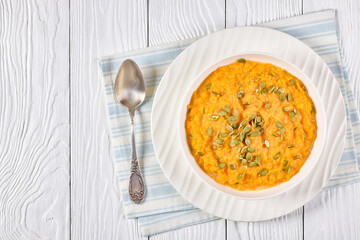 butternut squash puree with pumpkin seeds in bowl