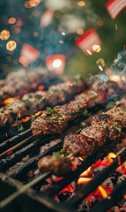 Close-up of seasoned skewers of meat and vegetables grilling barbecue over open flame, with sparks flying in summer heat during outdoor BBQ at backyard