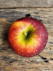 Ripe apple on wood background