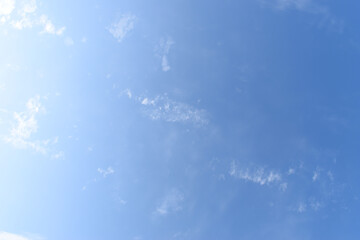 Wall Mural - beautiful blue sky and white fluffy group of clouds with sunrise in the morning, natural background