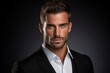 © Loli - Portrait of a handsome young man in a black suit. Men's beauty, fashion.