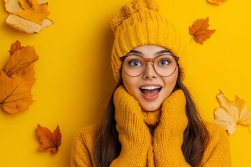 Wall Mural - A woman wearing a yellow hat and glasses surrounded by autumn leaves