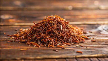 Wall Mural - Forced perspective of rooibos leaves on wooden table