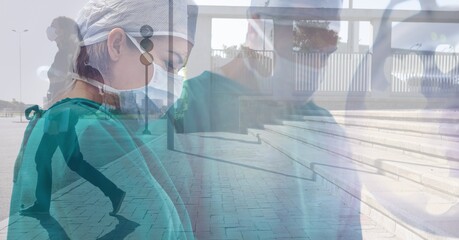 Canvas Print - Composite image of caucasian male and female surgeon against woman walking on the street