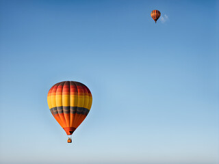 hot air balloon floating in the blue sky