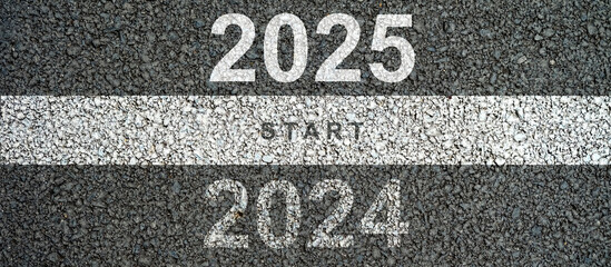 New year 2025 concept, beginning of success. Text 2025 written on asphalt road

