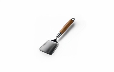 A stainless steel spatula with a wooden handle sits on a white background.