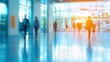 © ellisa_studio - Blurred Silhouettes of People Walking in a Modern Building