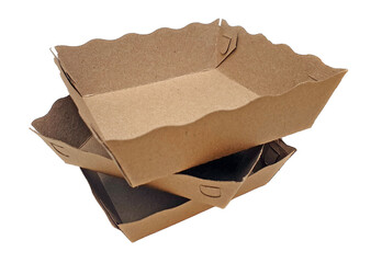 Stack of empty brown paper food trays isolated on white background. Blank, no label, mock up for brand logo. Disposable packaging. Fast food retail convenience concept.