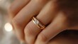 © Pornchai - Close-up of a beautiful rose gold ring adorned with a sparkling diamond, symbolizing love and commitment.