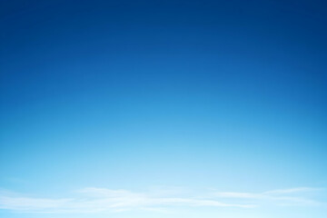 a beautiful clear blue sky with white clouds at the horizon.
