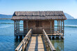 © Cavan Images - Traditional wooden house on the middle of Klisova lagoon in Greece
