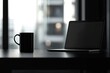 © ttonaorh - Laptop and coffee cup on black table in office. Workplace concept