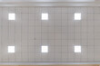 © hiv360 - cassette stretched or suspended ceiling with square halogen spots lamps and drywall construction in empty room in house or office. Looking up view