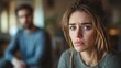 © AIExplosion - Domestic violence with an abused woman and a violent man in the background.