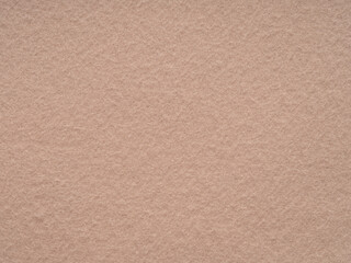 a soothing canvas of soft blush, this felt surface offers a delicate warmth, inviting a gentle, tact