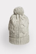 © daniiD - Gray knitted hat on a white background, a stylish and warm accessory for cold weather, suitable for any wardrobe
