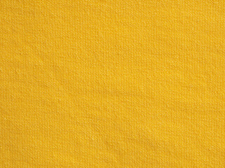 a close-up of bright yellow fabric with a textured pattern, adding brightness and liveliness, perfec