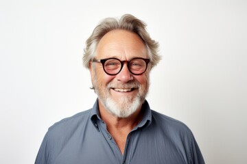 Portrait of a happy senior man in eyeglasses looking at camera