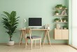 © natakot - A minimalist home office setup featuring a wooden desk, computer, and decorative plants against a green wall.