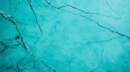 A textured, turquoise surface with visible cracks, evoking a sense of depth and intricacy.