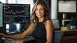 © Thanos - Portrait of a Smiling Female Trader at Her Desk with Trading Charts