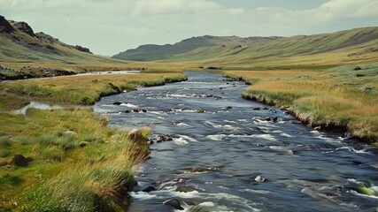 Wall Mural - tranquil river meanders through lush valley, surrounded by majestic mountains. green grass, vibrant 