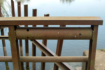 A rusted part of the lifting mechanism of an old dam	