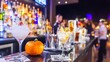 © wudu_8 - Halloween zombie-themed pub crawl in an American city glowing pumpkins on the bar counters