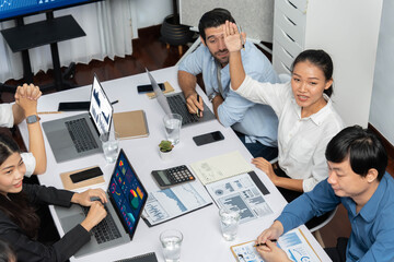 Office worker raise hand up asking for question during business meeting on data analysis using BI or business intelligence software for marketing and strategic planning. Prudent